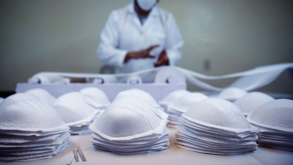 Ever Flores shows the face masks that his firm made to provide as protective gear to healthcare frontlines amid the coronavirus disease (COVID-19) outbreak in La Paz, Bolivia, April 6, 2020. - Sputnik International