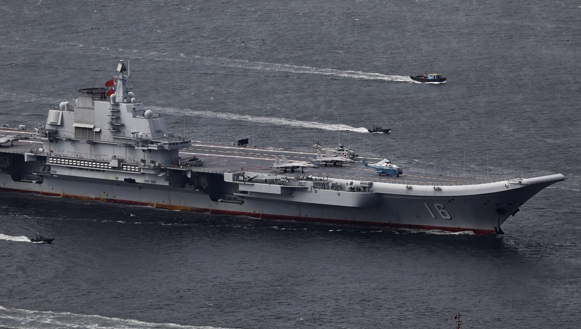In this July 7, 2017, file photo, the Liaoning, China's first aircraft carrier, sails into Hong Kong for a port call to celebrate the 20th anniversary of the People's Liberation Army (PLA) garrison's presence in the semi-autonomous Chinese city and former British colony In this July 7, 2017, file photo, the Liaoning, China's first aircraft carrier, sails into Hong Kong for a port call to celebrate the 20th anniversary of the People's Liberation Army (PLA) garrison's presence in the semi-autonomous Chinese city and former British colony - Sputnik International, 1920, 22.07.2021