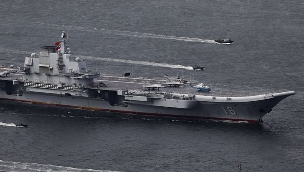 In this July 7, 2017, file photo, the Liaoning, China's first aircraft carrier, sails into Hong Kong for a port call to celebrate the 20th anniversary of the People's Liberation Army (PLA) garrison's presence in the semi-autonomous Chinese city and former British colony - Sputnik International