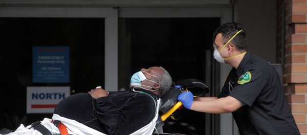 Paramedics take a patient into emergency center at Maimonides Medical Center during outbreak of coronavirus disease (COVID-19) in Brooklyn New York - Sputnik International