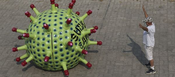 Indian car designer K. Sudhakar Yadav gestures beside a Coronavirus themed car at his museum he made as part of an awareness campaign aimed at preventing the spread of the virus in Hyderabad, India, Tuesday, April 7, 2020 - Sputnik International