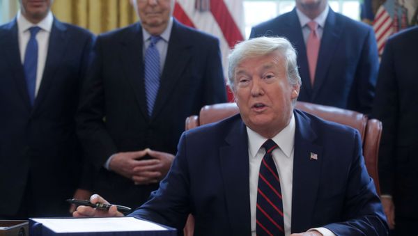 U.S. President Donald Trump hosts a signing ceremony for the $2.3 trillion coronavirus aid package bill in the Oval Office of the White House in Washington, U.S., March 27, 2020 U.S. President Donald Trump hosts a signing ceremony for the $2.3 trillion coronavirus aid package bill in the Oval Office of the White House in Washington, U.S., March 27, 2020 - Sputnik International