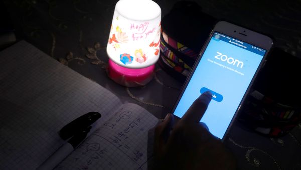 A student takes class online while using the Zoom app at her home as Egypt shut down schools as the spread of the coronavirus disease (COVID-19) continues, in Cairo, Egypt April 5, 2020 A student takes class online while using the Zoom app at her home as Egypt shut down schools as the spread of the coronavirus disease (COVID-19) continues, in Cairo, Egypt April 5, 2020 - Sputnik International