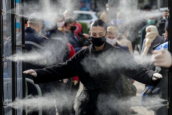 People are disinfected before entering a market, as Albanian authorities take measures to stop the spread of the coronavirus disease (COVID-19), in Tirana, Albania April 6, 2020.  - Sputnik International