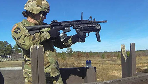 Sgt. Keala Burks, a drill sergeant with Alpha Company, 3rd Battalion, 60th Infantry Regiment, fires one of the nearly 30 rounds she shot during training on the M320 grenade launcher. - Sputnik International