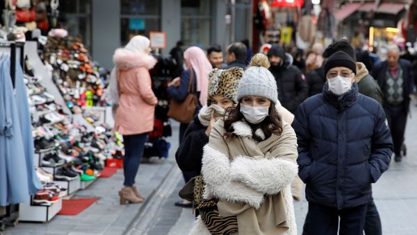 People wear protective face masks due to coronavirus concerns in Istanbul, Turkey March 16, 2020. - Sputnik International