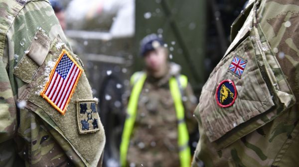 A British and an United States soldier stand side by side after a press conference on the military exercise 'Defender 2020' in Brueck, Germany, Wednesday, Feb. 26, 2020. The exercise with 37000 participants from a total of 18 nations will take place in Europe between January and about June 2020. A British and an United States soldier stand side by side after a press conference on the military exercise 'Defender 2020' in Brueck, Germany, Wednesday, Feb. 26, 2020. The exercise with 37000 participants from a total of 18 nations will take place in Europe between January and about June 2020. - Sputnik International