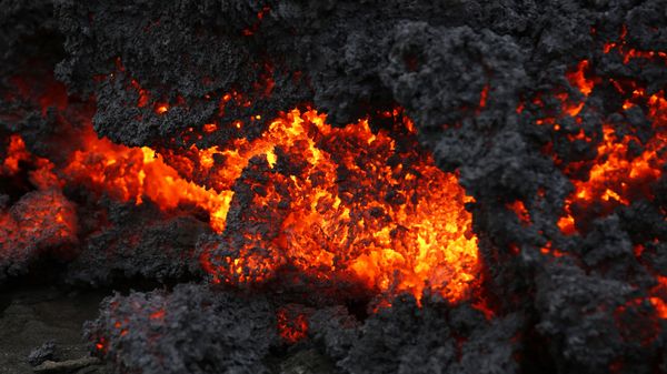 A close up of lava from an eruption on Holuhraun, northwest of the Dyngjujoekull glacier in Iceland, Monday, Sept. 1, 2014.  Lava fountains danced along a lengthy volcanic fissure near Iceland's subglacial Bardarbunga volcano Sunday, prompting authorities to raise the aviation warning code to the highest level and close the surrounding airspace. The warning was lowered 12 hours later as visibility improved and it was clear that no volcanic ash was detected. - Sputnik International