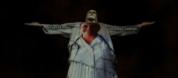 The statue of Christ the Redeemer is lit up with the image of a medical worker during an Easter Sunday event, amid the coronavirus disease (COVID-19) outbreak, in Rio de Janeiro, Brazil April 12, 2020 The statue of Christ the Redeemer is lit up with the image of a medical worker during an Easter Sunday event, amid the coronavirus disease (COVID-19) outbreak, in Rio de Janeiro, Brazil April 12, 2020 - Sputnik International