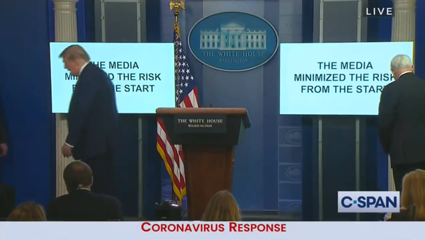 US President Donald Trump walks off stage at a White House press conference before playing a video many derided as a campaign ad - Sputnik International