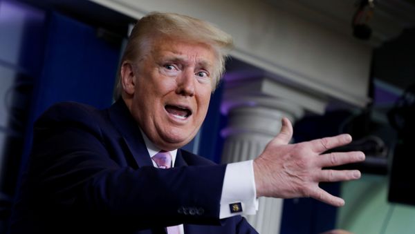 U.S. President Donald Trump answers a question from CNN's chief White House correspondent Jim Acosta about hospitals and frontline health care workers reporting shortages of masks and coronavirus tests during the coronavirus response daily briefing at the White House in Washington, U.S., April 10, 2020 - Sputnik International
