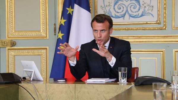 French President Emmanuel Macron takes part in a video conference with World Health Organization (WHO) general director Tedros Adhanom Ghebreyesus at the Elysee Palace in Paris, France April 8, 2020 - Sputnik International