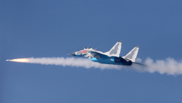 A MiG-29 of the Korean People’s Anti-Air Force (KPAAF) fires a missile at a simulated target during air combat exercises - Sputnik International