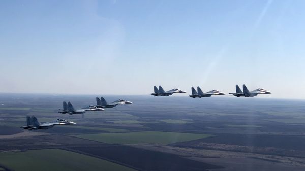 In this handout photo released by the Russian Defence Ministry, Su-30SM jet fighters of the 4th Air and Air Defence Forces Army of the Russian Southern Military District fly in formation during a rehearsal for the Victory Day parade in Rostov-on-Don, which marks the 75th anniversary of the victory over Nazi Germany in World War Two, in Rostov region, Russia - Sputnik International