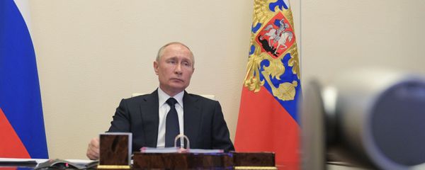 Russian President Vladimir Putin attends a meeting with members of the government via teleconference call at Novo-Ogaryovo state residence, outside Moscow, Russia - Sputnik International