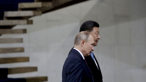 Russia's President Vladimir Putin and China's President Xi Jinping walk after the family photo of leaders of the BRICS emerging economies at the Itamaraty palace in Brasilia, Brazil, Thursday, Nov. 14, 2019 - Sputnik International