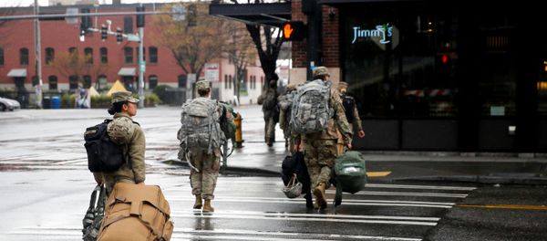 Soldiers from the 627th Army Hospital from Fort Carson, Colorado walk across the street after working at CenturyLink Field Event Center, which is being turned into a military field hospital for non coronavirus patients during the coronavirus disease (COVID-19) outbreak in Seattle, Washington, U.S. March 30, 2020 Soldiers from the 627th Army Hospital from Fort Carson, Colorado walk across the street after working at CenturyLink Field Event Center, which is being turned into a military field hospital for non coronavirus patients during the coronavirus disease (COVID-19) outbreak in Seattle, Washington, U.S. March 30, 2020 - Sputnik International