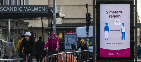 An advertisement of the healthcare services of Sweden instructs people to follow the 2 meters rule to reduce the risk of getting sick, in Stockholm on April 14, 2020. - Sputnik International