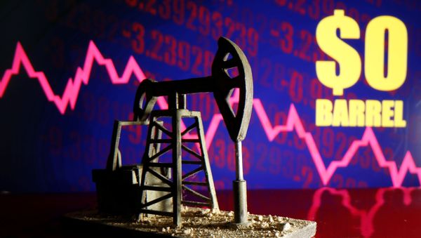 A 3D-printed oil pump jack is seen in front of a displayed stock graph and $0 Barrel words in this illustration picture, April 20, 2020 - Sputnik International