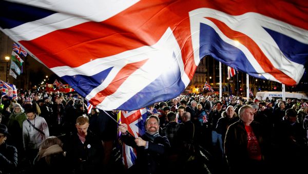 A man waves a British flag on Brexit day in London, Britain January 31, 2020 - Sputnik International