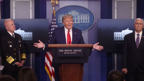 U.S. President Donald Trump addresses the daily coronavirus task force briefing between U.S. Assistant Secretary for Health Admiral Brett Giroir and Vice President Mike Pence at the White House in Washington, U.S., April 20, 2020. - Sputnik International