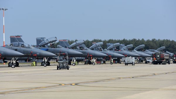 F-15E Strike Eagles assigned to the 492nd and 494th Fighter Squadrons line the taxiway at Royal Air Force Lakenheath, England, April 16, 2020.  - Sputnik International