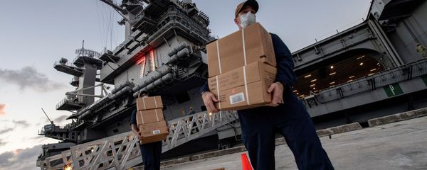U.S. Navy sailors assigned to the aircraft carrier USS Theodore Roosevelt carry meals in Guam U.S. Navy sailors assigned to the aircraft carrier USS Theodore Roosevelt carry meals in Guam - Sputnik International