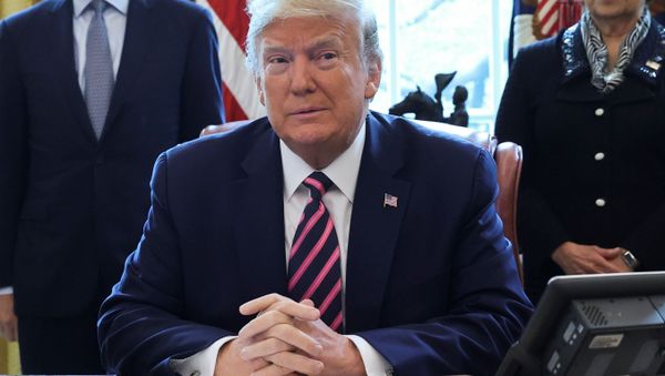 U.S. President Donald Trump participates in a signing ceremony for the Paycheck Protection Program and Health Care Enhancement Act, approving additional coronavirus disease (COVID-19) relief for the U.S. economy and hospitals treating people sickened by the pandemic, in the Oval Office at the White House in Washington, U.S., April 24, 2020 - Sputnik International