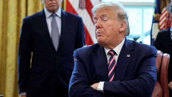 U.S. President Donald Trump looks down at the Paycheck Protection Program and Health Care Enhancement Act, approving additional coronavirus disease (COVID-19) relief for the U.S. economy and hospitals treating people sickened by the pandemic, during a signing ceremony in the Oval Office at the White House in Washington, U.S., April 24, 2020 U.S. President Donald Trump looks down at the Paycheck Protection Program and Health Care Enhancement Act, approving additional coronavirus disease (COVID-19) relief for the U.S. economy and hospitals treating people sickened by the pandemic, during a signing ceremony in the Oval Office at the White House in Washington, U.S., April 24, 2020 - Sputnik International