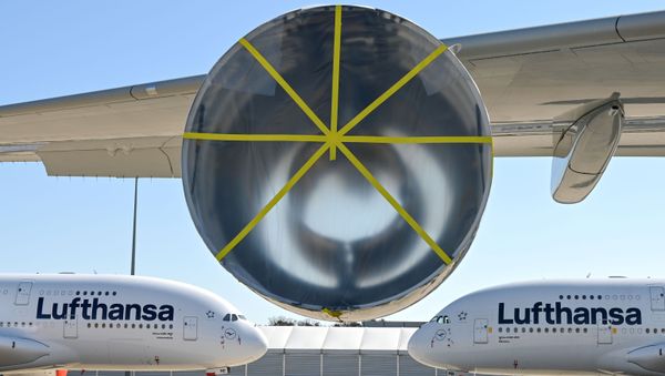 Two Lufthansa Airbus A380-800 passenger planes are parked as air traffic is affected by the spread of the coronavirus disease (COVID-19), in Frankfurt, Germany, 23 March 2020 - Sputnik International