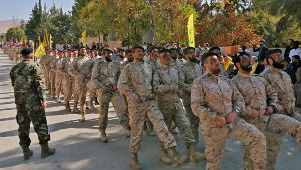 Fighters from the Lebanese Shiite Hezbollah movement in the eastern Bekaa Valley city of Baalbeck - Sputnik International