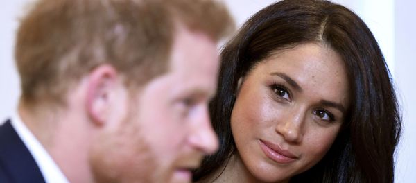 The Duchess of Sussex gazes at her husband Prince Harry - Sputnik International