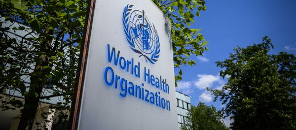 This picture taken on April 24, 2020 shows a sign of the World Health Organization (WHO) in Geneva next to their headquarters, amid the COVID-19 outbreak, caused by the novel coronavirus - Sputnik International