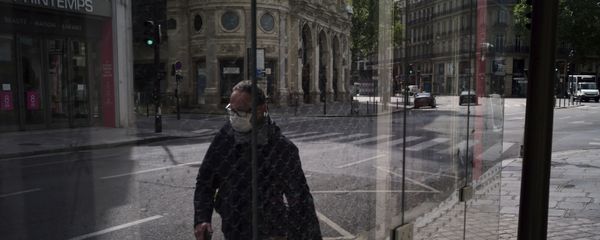 A man wears a face mask to protect against the spread of the new coronavirus as he walks in a street of Paris, Wednesday, April 29, 2020. France continues to be under an extended stay-at-home order until May 11 in an attempt to slow the spread of the COVID-19 pandemic.  - Sputnik International