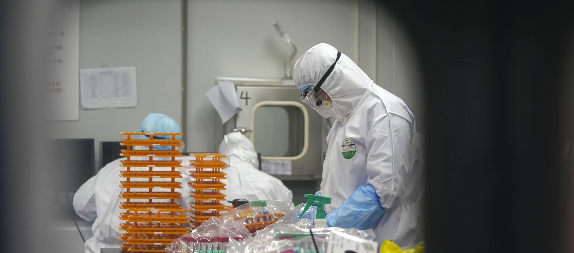 This Saturday, Feb. 22, 2020, photo released by Xinhua News Agency, shows medical workers in protective suits at a coronavirus detection lab in Wuhan in central China's Hubei Province. The fresh national figures for the disease that emerged in China in December came as the number of viral infections soared mostly in and around the southeastern city of Daegu, where they were linked to a local church and a hospital. - Sputnik International, 1920, 06.08.2021