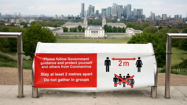 A sign is seen telling people to socially distance in Greenwich Park, following the outbreak of the coronavirus disease (COVID-19), London, Britain, May 4, 2020 A sign is seen telling people to socially distance in Greenwich Park, following the outbreak of the coronavirus disease (COVID-19), London, Britain, May 4, 2020 - Sputnik International