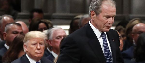 Former President George W. Bush walks past President Donald Trump to speak at the State Funeral for his father, former President George H.W. Bush, at the State Funeral at the National Cathedral, Wednesday, Dec. 5, 2018, in Washington Former President George W. Bush walks past President Donald Trump to speak at the State Funeral for his father, former President George H.W. Bush, at the State Funeral at the National Cathedral, Wednesday, Dec. 5, 2018, in Washington - Sputnik International