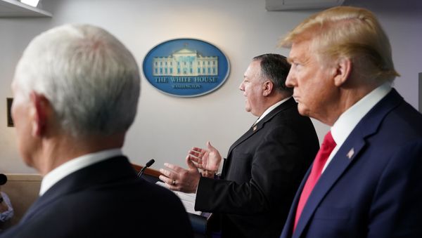 U.S. Vice President Mike Pence and President Donald Trump listen as Secretary of State Mike Pompeo addresses the daily coronavirus task force briefing at the White House in Washington, U.S., April 8, 2020 U.S. Vice President Mike Pence and President Donald Trump listen as Secretary of State Mike Pompeo addresses the daily coronavirus task force briefing at the White House in Washington, U.S., April 8, 2020 - Sputnik International