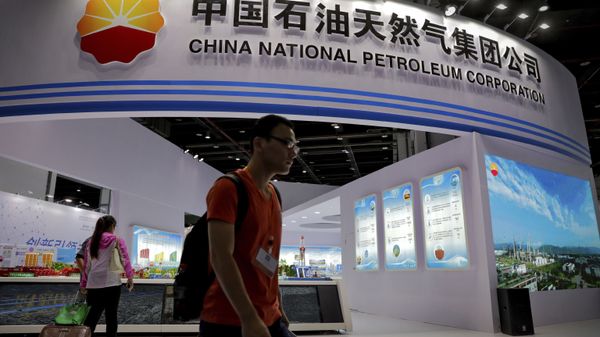 In this Sept. 21, 2016, photo, visitors walk by the China National Petroleum Corporation (CNPC) exhibition booth during the China International Chemical Industry Fair in Shanghai, China. - Sputnik International