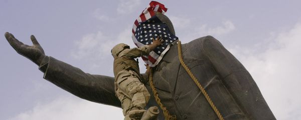 In this file photo taken Wednesday, April 9, 2003, an Iraqi man, bottom right, watches Cpl. Edward Chin of the 3rd Battalion, 4th Marines Regiment, cover the face of a statue of Saddam Hussein with an American flag before toppling the statue in downtown in Baghdad, Iraq. In this file photo taken Wednesday, April 9, 2003, an Iraqi man, bottom right, watches Cpl. Edward Chin of the 3rd Battalion, 4th Marines Regiment, cover the face of a statue of Saddam Hussein with an American flag before toppling the statue in downtown in Baghdad, Iraq. - Sputnik International