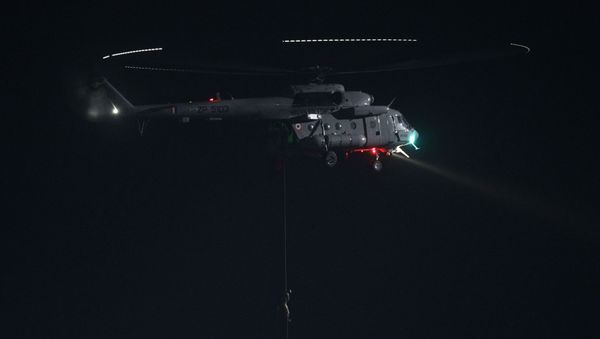 An Indian soldier climbs drown from a Mi 17 V5 as he recreates a battle scene during the Iron Fist 2013 exercise, in Pokharan, India, Friday, Feb. 22, 2013 - Sputnik International