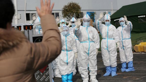 FILE PHOTO: Medical personnel in protective suits wave hands to a patient who is discharged from the Leishenshan Hospital after recovering from the novel coronavirus, in Wuhan, the epicentre of the novel coronavirus outbreak, in Hubei province, China March 1, 2020 FILE PHOTO: Medical personnel in protective suits wave hands to a patient who is discharged from the Leishenshan Hospital after recovering from the novel coronavirus, in Wuhan, the epicentre of the novel coronavirus outbreak, in Hubei province, China March 1, 2020 - Sputnik International