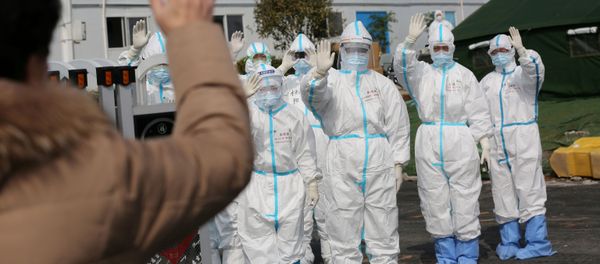 FILE PHOTO: Medical personnel in protective suits wave hands to a patient who is discharged from the Leishenshan Hospital after recovering from the novel coronavirus, in Wuhan, the epicentre of the novel coronavirus outbreak, in Hubei province, China March 1, 2020 FILE PHOTO: Medical personnel in protective suits wave hands to a patient who is discharged from the Leishenshan Hospital after recovering from the novel coronavirus, in Wuhan, the epicentre of the novel coronavirus outbreak, in Hubei province, China March 1, 2020 - Sputnik International