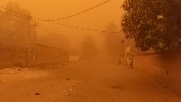 In this photo taken Monday, May 4, 2020, dust fills a street after a dust cloud swept over the capital Niamey, Niger - Sputnik International