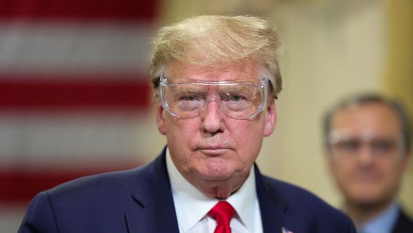 U.S. President Donald Trump looks at an assembly line during a tour of Honeywell's facility manufacturing protective face masks for the coronavirus disease (COVID-19) outbreak in Phoenix, Arizona, U.S., May 5, 2020 U.S. President Donald Trump looks at an assembly line during a tour of Honeywell's facility manufacturing protective face masks for the coronavirus disease (COVID-19) outbreak in Phoenix, Arizona, U.S., May 5, 2020 - Sputnik International