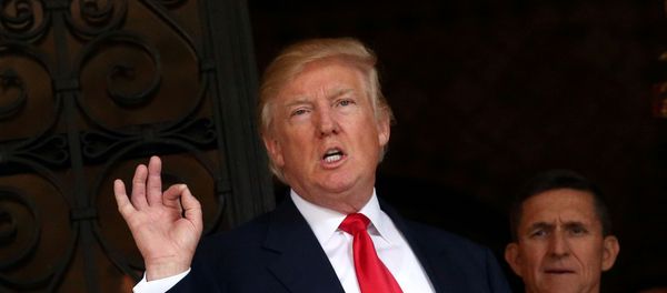 U.S. President-elect Donald Trump talks to members of the media as retired U.S. Army Lieutenant General Michael Flynn stands next to him at Mar-a-Lago estate in Palm Beach, Florida, U.S., December 21, 2016 U.S. President-elect Donald Trump talks to members of the media as retired U.S. Army Lieutenant General Michael Flynn stands next to him at Mar-a-Lago estate in Palm Beach, Florida, U.S., December 21, 2016 - Sputnik International