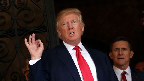 U.S. President-elect Donald Trump talks to members of the media as retired U.S. Army Lieutenant General Michael Flynn stands next to him at Mar-a-Lago estate in Palm Beach, Florida, U.S., December 21, 2016 U.S. President-elect Donald Trump talks to members of the media as retired U.S. Army Lieutenant General Michael Flynn stands next to him at Mar-a-Lago estate in Palm Beach, Florida, U.S., December 21, 2016 - Sputnik International
