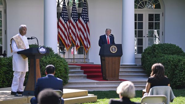 Pujari Harish Brahmbhatt, B.A.P.S. Shri Swaminarayan Mandir, Robbinsville, speaks as US President Donald Trump looks on during the National Day of Prayer Service event at the Rose Garden of the White House in Washington, DC on May 7, 2020.  - Sputnik International