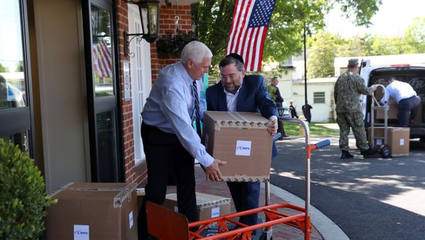 U.S. Vice President Mike Pence unloads boxes of personal protective equipment (PPE) with Norman Rokeach, CEO of Marquis Health Services, while helping to deliver a shipment that was provided by the Federal Emergency Management Administration (FEMA) to the Woodbine Rehabilitation and Healthcare Center in Alexandria, Virginia., U.S., May 7, 2020 - Sputnik International