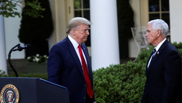 U.S. President Donald Trump turns to Vice President Mike Pence as they depart following a coronavirus response news conference in the Rose Garden at the White House in Washington, U.S., April 27, 2020. - Sputnik International